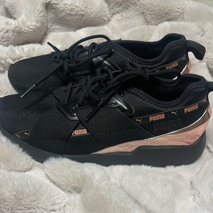 Black and rose gold pumas